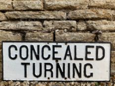 A cast iron road sign for 'Concealed Turning', 27 1/4 x 10 1/4".