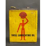 A Shell Lubricating Oil gallon can with robot/stick man motif to one side, good bright condition.