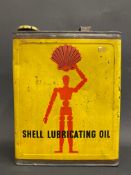 A Shell Lubricating Oil gallon can with robot/stick man motif to one side, good bright condition.