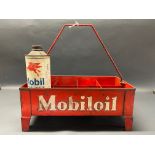 A Mobiloil eight division garage forecourt crate, with one quart can inside.