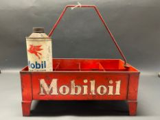 A Mobiloil eight division garage forecourt crate, with one quart can inside.