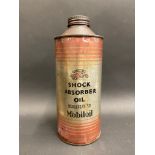 A Gargoyle Shock Absorber Oil quart cylindrical oil can.