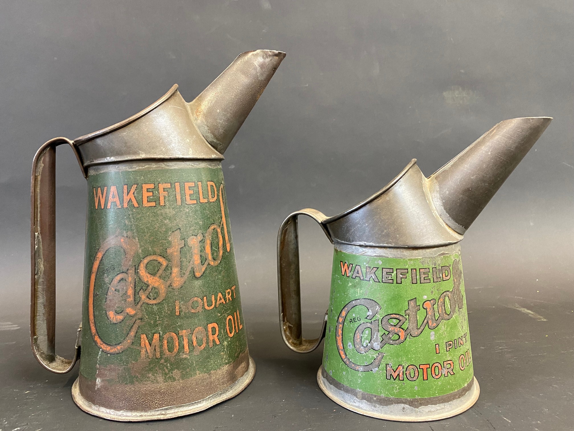 A Wakefield Castrol quart oil measure and a pint similar.