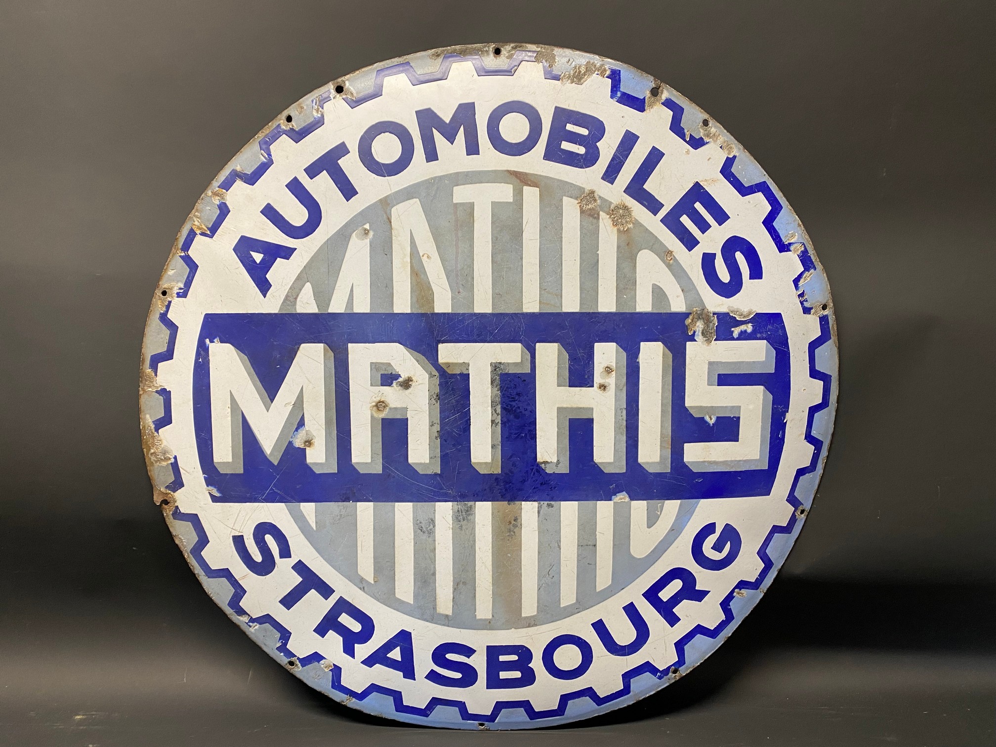 A Mathis circular enamel sign, 27 1/2" diameter.