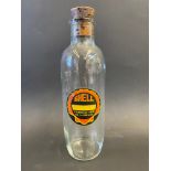 An early Shell Lubricating Oils and Greases glass bottle, with original label.
