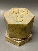 An NBC hexagonal brass bulk tank cap.