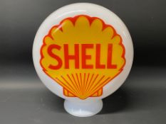 A reproduction Shell pill-shaped glass petrol pump globe.