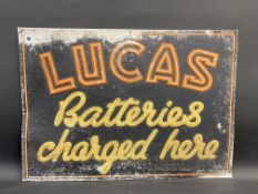 A Lucas Batteries Charged Here rectangular tin advertising sign, 27 x 19".