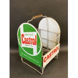 A Wakefield Castrol Motor Oil nine-division crate with four enamel signs attached.