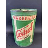 A Wakefield Castrol Motor Oil five gallon drum with dispensing tap.