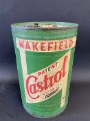 A Wakefield Castrol Motor Oil five gallon drum with dispensing tap.