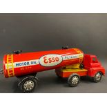 A tinplate model of an Esso articulated tanker, with plastic cab, in good condition.