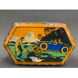 A Mackintosh's assorted toffee tin with image of a motor car to the lid.