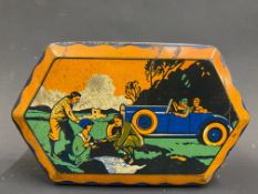 A Mackintosh's assorted toffee tin with image of a motor car to the lid.