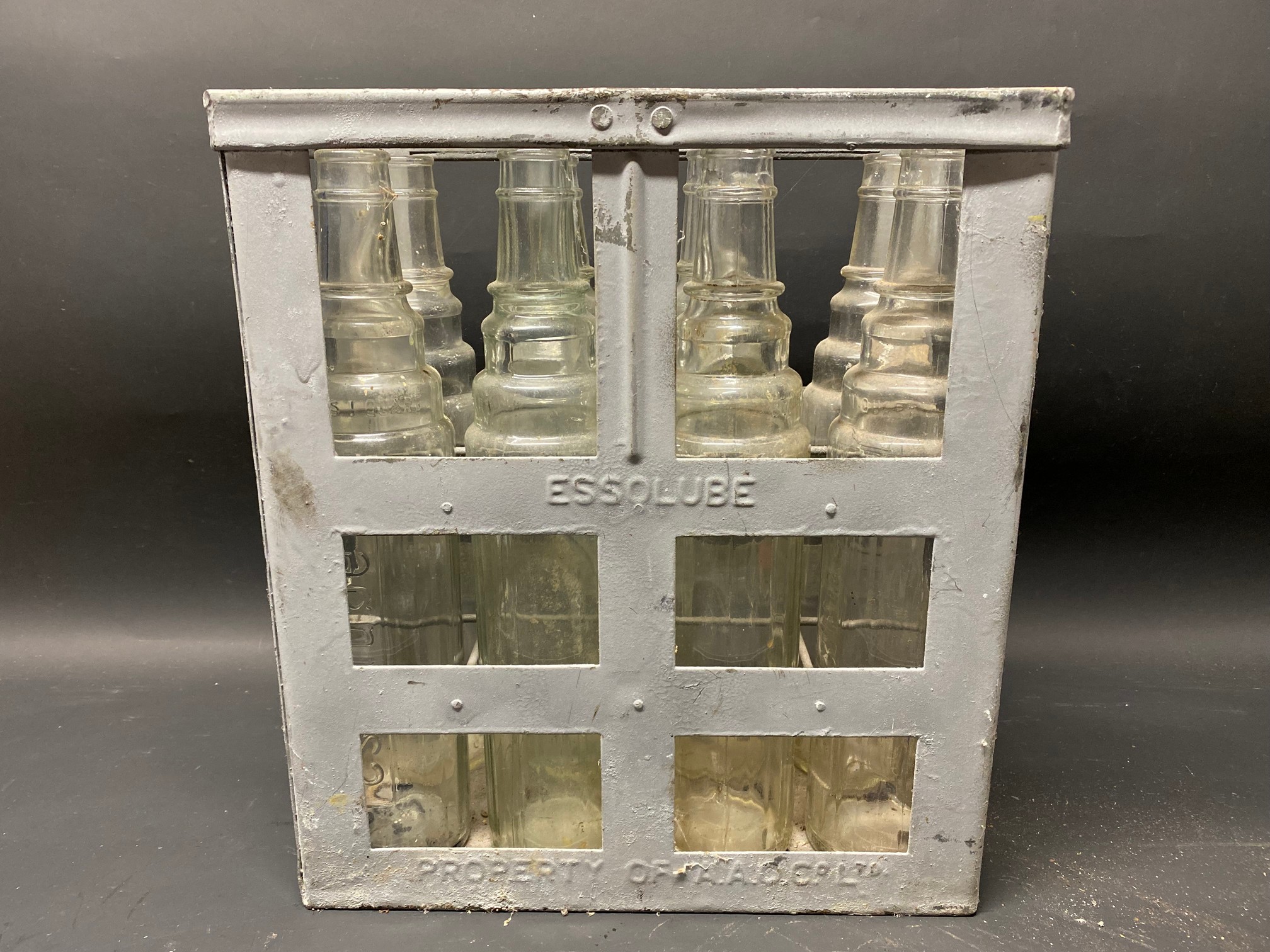 An Essolube eight division crate containing a full set of Essolube quart bottles.