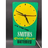 A Smiths Quick-Start Batteries wall clock, 9 x 16 1/2".