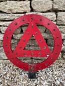 A circular post mounted road warning sign, with inset red glass beads, 24" diameter.