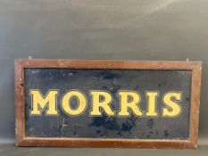 A wooden framed hardboard sign advertising Morris, 40 x 19".