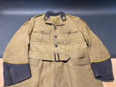 An original AA patrolman's tunic, with brass AA badges to the lapels, embroidered badges for