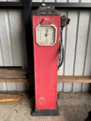 An Avery Hardoll clock faced electric petrol pump for restoration, with rubber hose and nozzle.