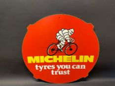A Michelin 'Tyres You Can Trust' pictorial hardboard advertising sign, 252 diameter.
