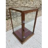 An oak framed table top display cabinet, with glass all-round and two glass shelves inside, 16 1/