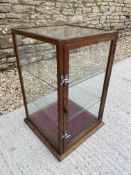 An oak framed table top display cabinet, with glass all-round and two glass shelves inside, 16 1/