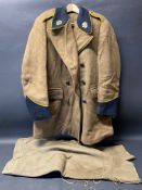 An original AA overcoat, with bakelite AA buttons and brass AA badges to the lapels, plus a pair