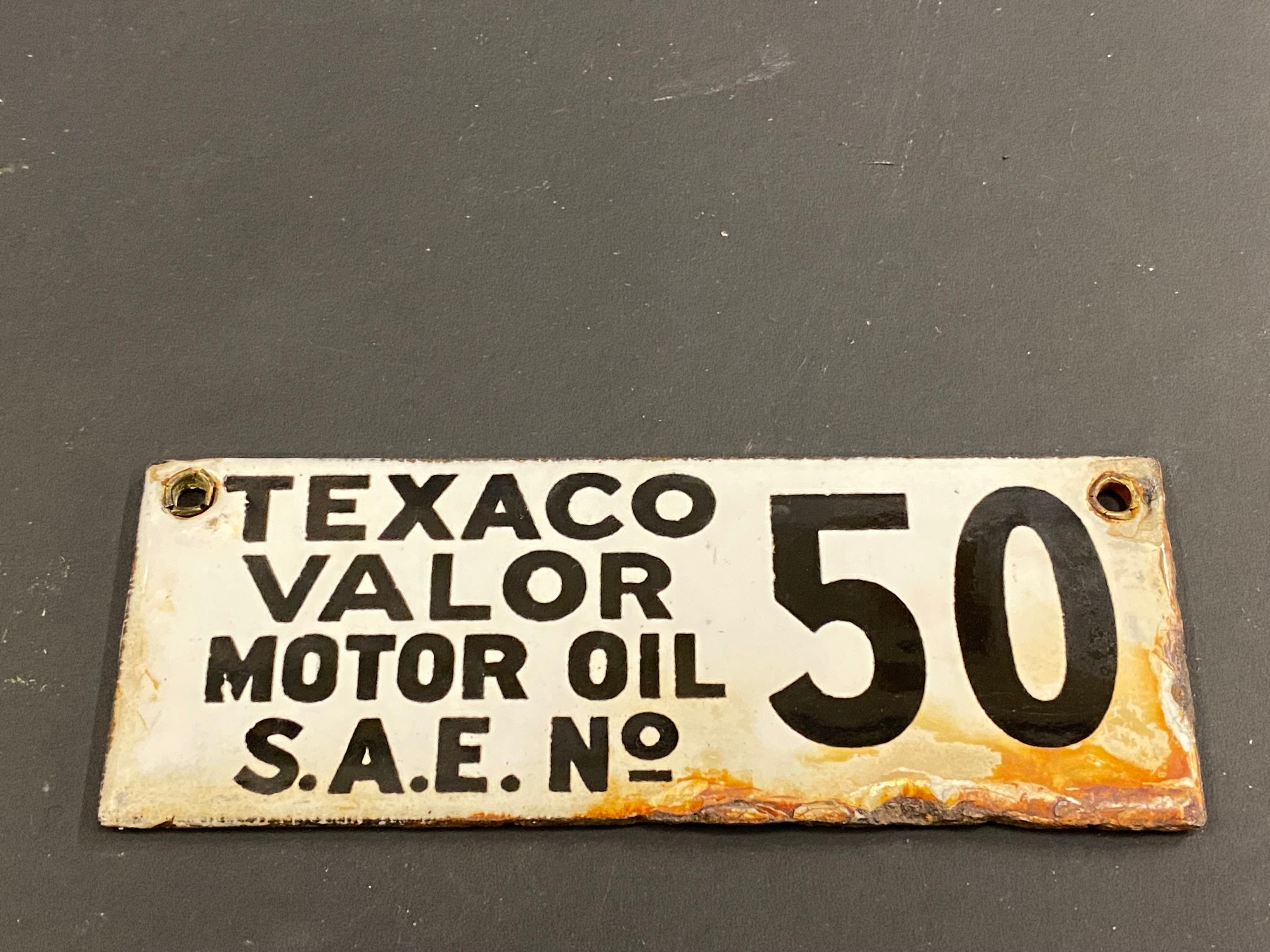 A small double sided enamel brand plaque for Texaco Valor Motor Oil, 4 x 1 1/2".
