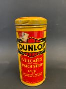 A Dunlop Vulcafix Patch Strip cylindrical tin, in very good condition.