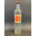 A Shell X-100 Motor Oil quart bottle with good label.