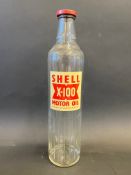 A Shell X-100 Motor Oil quart bottle with good label.