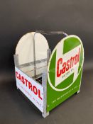 A Castrol Motor Oil nine-division crate with four enamel signs attached.