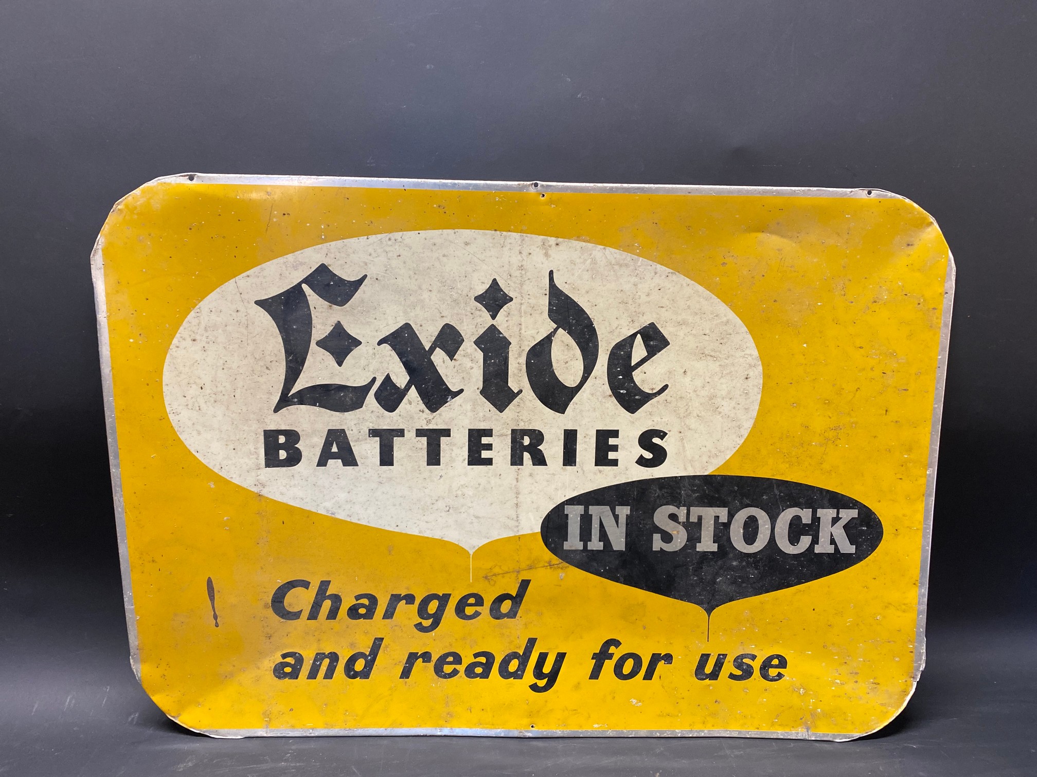 An Exide Batteries aluminium advertising sign, 24 1/2 x 17".