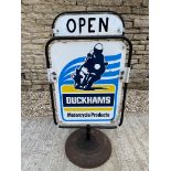 A Duckham's Motor Cycle Dealer Open/Closed swivel sign on a weighted base.