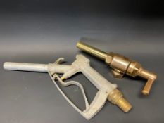 A bronze petrol pump trigger and one later version.