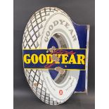 A Continental Goodyear tyre-shaped double sided enamel sign with hanging flange, 22 x 34".