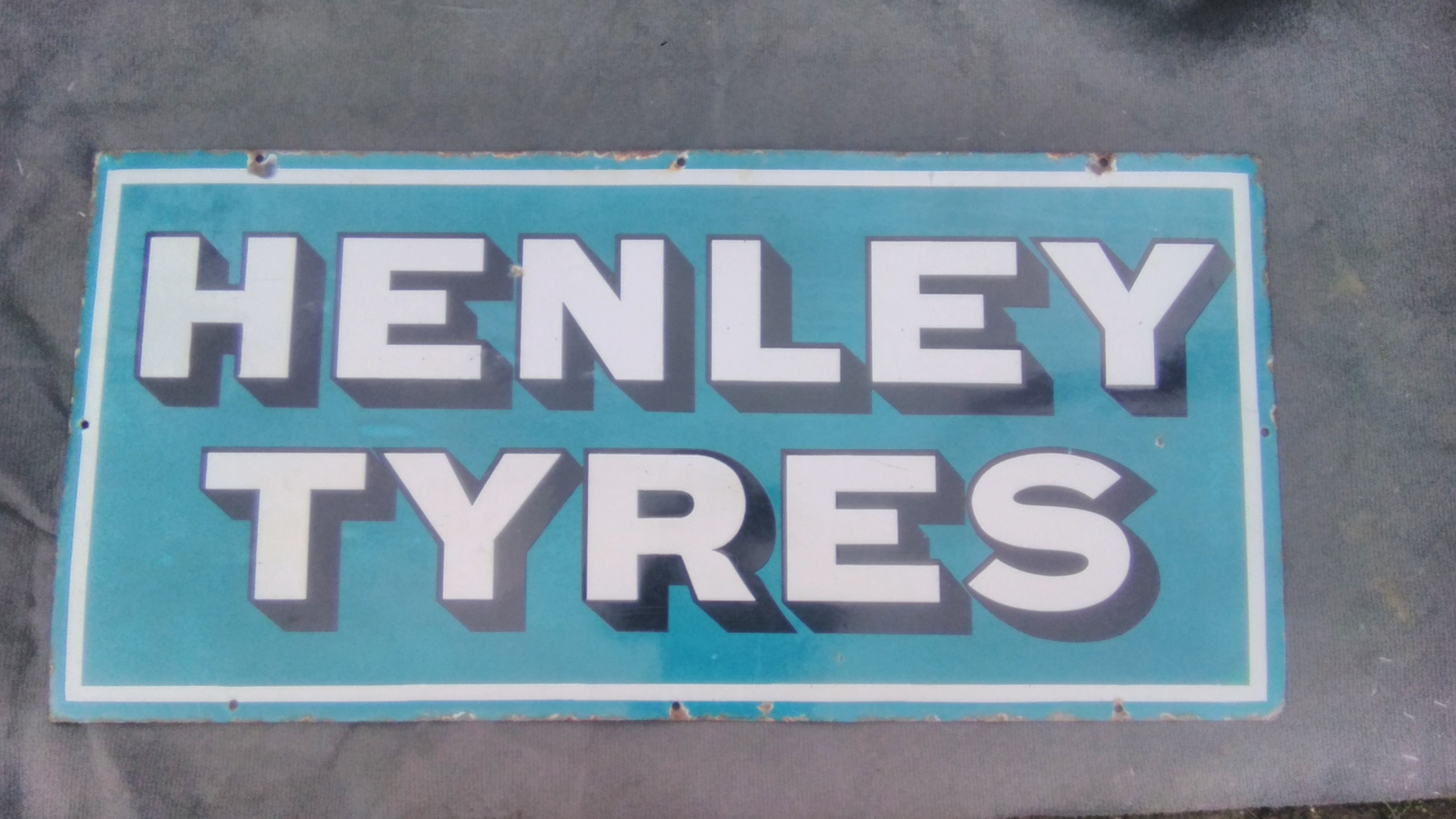 A Henley Tyres rectangular enamel sign, 39 x 18 1/2".