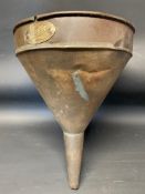 A large circular Pratts funnel with brass label.