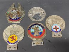Five St. Christopher car badges, two with enamel location plaques for London and Scotland.