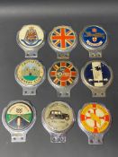 Nine assorted car badges including Jones-Shipman Car Club.