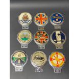 Nine assorted car badges including Jones-Shipman Car Club.