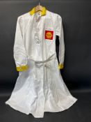 A circa 1960s Shell branded attendant's overcoat with yellow collar and cuffs, by Supercraft of