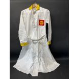 A circa 1960s Shell branded attendant's overcoat with yellow collar and cuffs, by Supercraft of