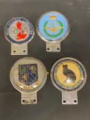Four assorted car badges including Clan McPherson by Beaulah.
