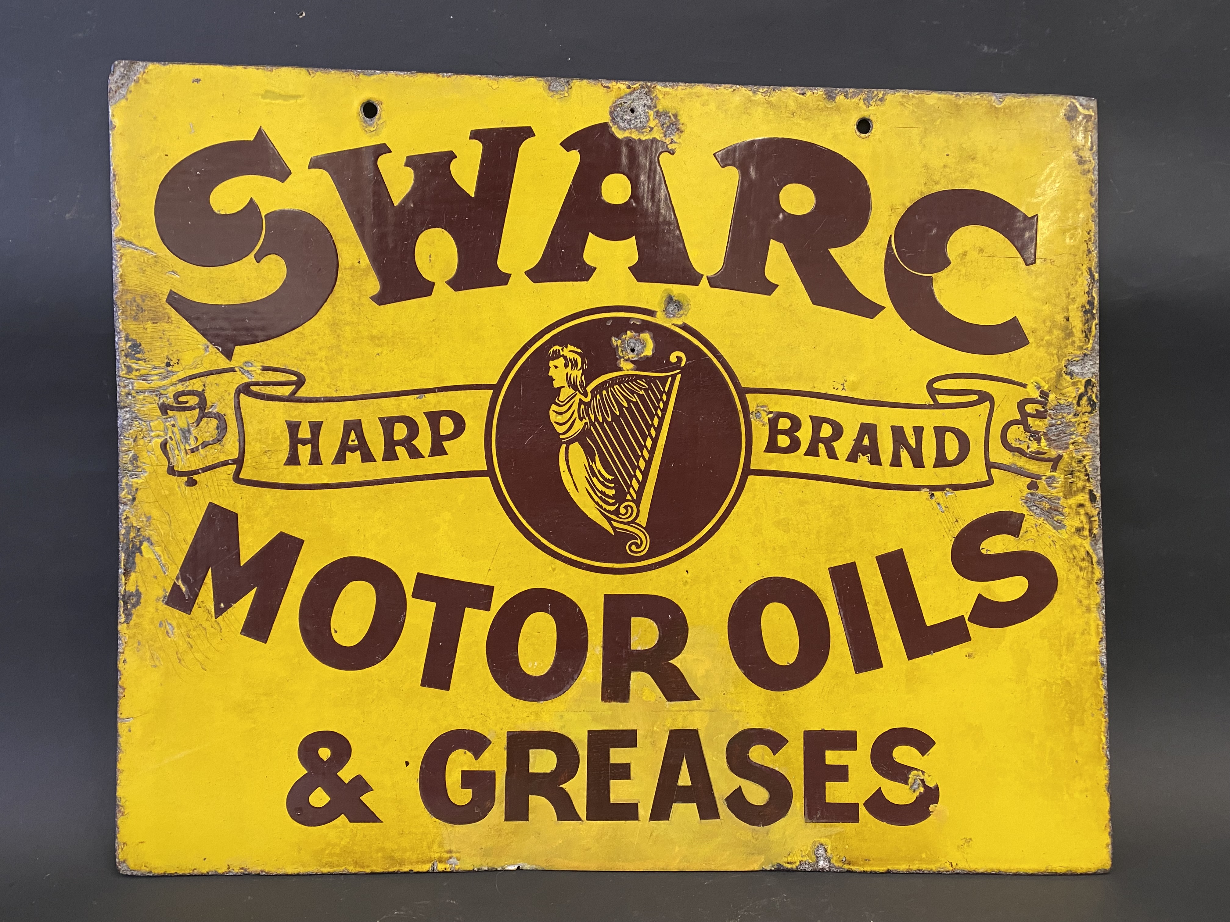 A rare SWARC Motor Oils & Greases double sided enamel sign in good condition, some minor