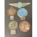 A small collection of caravan and camping related car badges plus an Abbey Caravan Company badge.