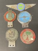 A small collection of caravan and camping related car badges plus an Abbey Caravan Company badge.