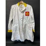 A circa 1960s Shell branded attendant's overcoat with yellow collar and cuffs, by Supercraft of