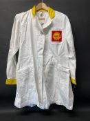 A circa 1960s Shell branded attendant's overcoat with yellow collar and cuffs, by Supercraft of